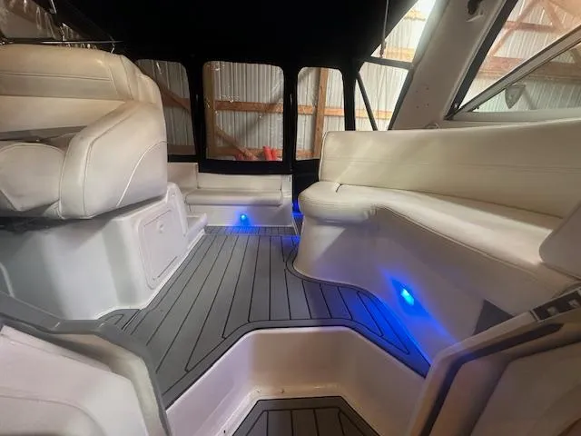  Yacht Photos Pics Interior of 2005 Cruisers Yachts 340 Express with white seating and blue LED lights.