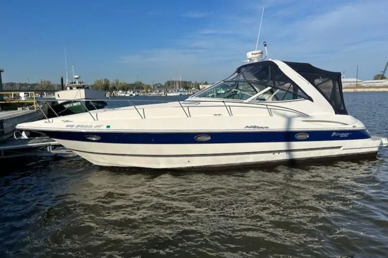  Yacht Photos Pics 2005 Cruisers Yachts 340 Express boat docked on a sunny day.