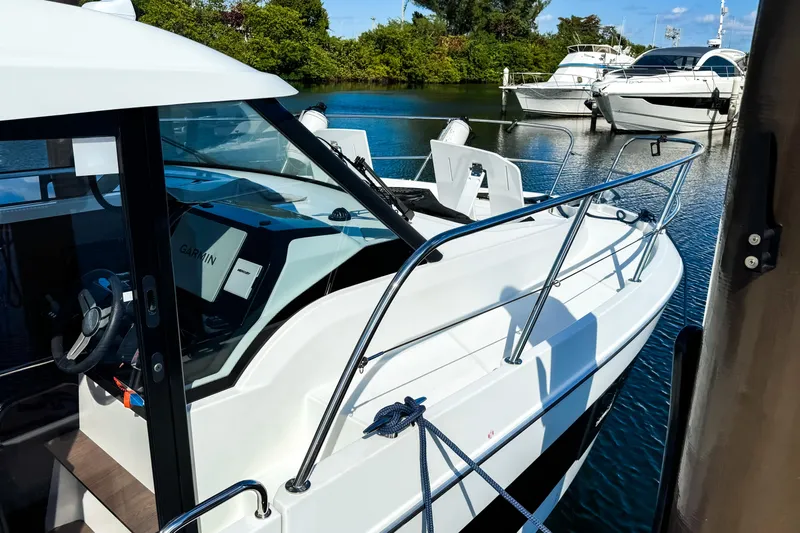 Yacht Photos Pics 2023 Beneteau Antares 11 boat docked, showcasing sleek design and modern features.