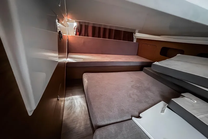  Yacht Photos Pics 2023 Beneteau Antares 11 cabin interior with modern design and comfortable seating.