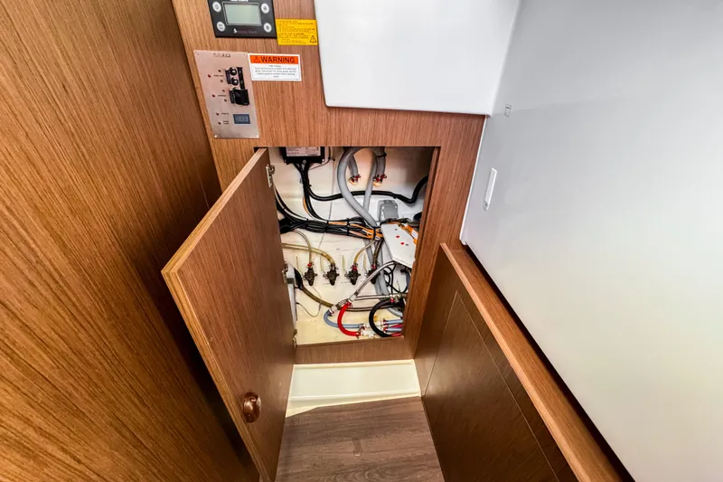  Yacht Photos Pics Electrical panel and wiring inside 2023 Beneteau Antares 11 boat.