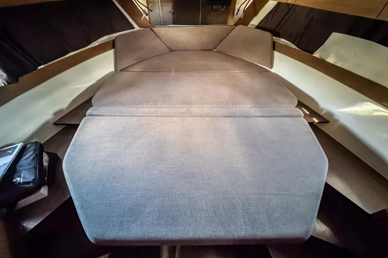  Yacht Photos Pics 2023 Beneteau Antares 11 interior cabin with comfortable seating and modern design.