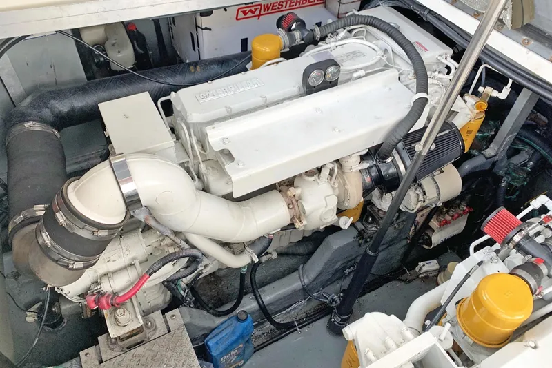 Makai Yacht Photos Pics Engine compartment of a 2000 Sea Ray 410 Sundancer boat, featuring a diesel engine.