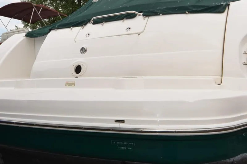 Serenity Yacht Photos Pics 2004 Sea Ray 340 Sundancer boat with green cover, rear view.