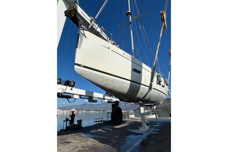 Deiopea Yacht Photos Pics Italia Yachts IY13.98 2013 model being lifted at a marina, clear blue sky.