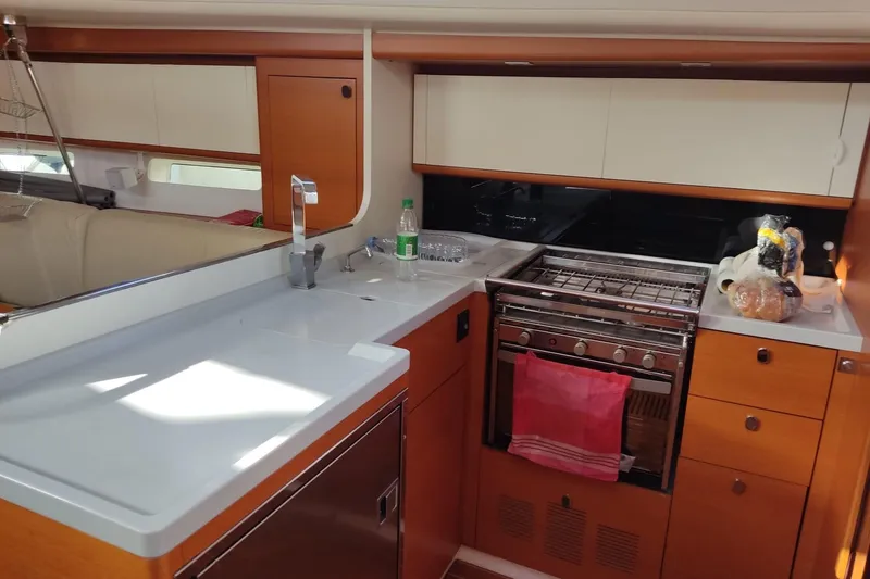 Deiopea Yacht Photos Pics Modern kitchen interior of 2013 Italia Yachts IY13.98 with stove and sink.