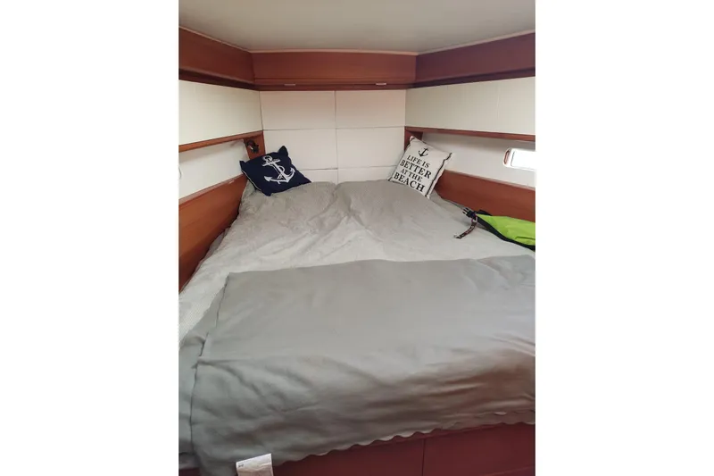 Deiopea Yacht Photos Pics Cozy cabin interior of 2013 Italia Yachts IY13.98 with nautical-themed pillows.