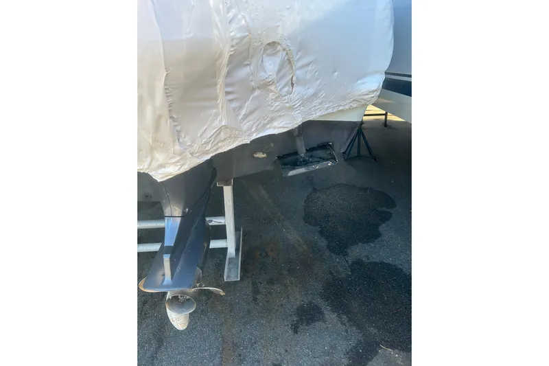  Yacht Photos Pics 2015 Sailfish 290 CC boat with covered hull and visible outboard motor.