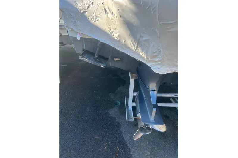  Yacht Photos Pics 2015 Sailfish 290 CC boat propeller and covered hull on trailer.