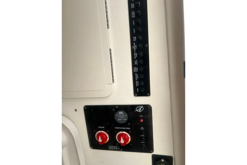  Yacht Photos Pics Control panel of a 2015 Sailfish 290 CC boat, featuring switches and dials.
