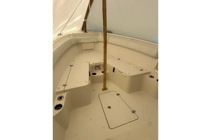  Yacht Photos Pics 2015 Sailfish 290 CC boat interior with seating and storage compartments.