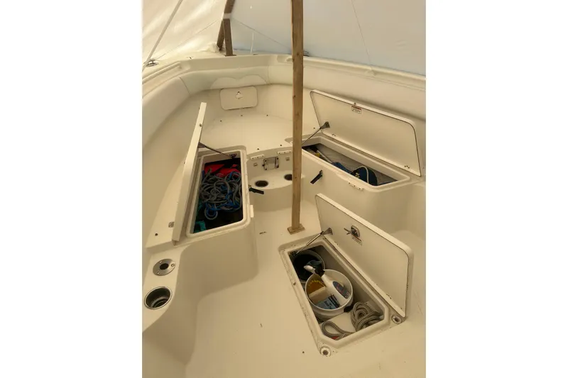  Yacht Photos Pics 2015 Sailfish 290 CC boat interior with open storage compartments.