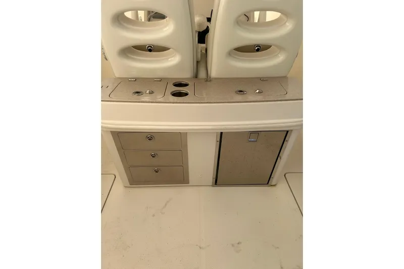  Yacht Photos Pics 2015 Sailfish 290 CC boat interior with storage drawers and seating.