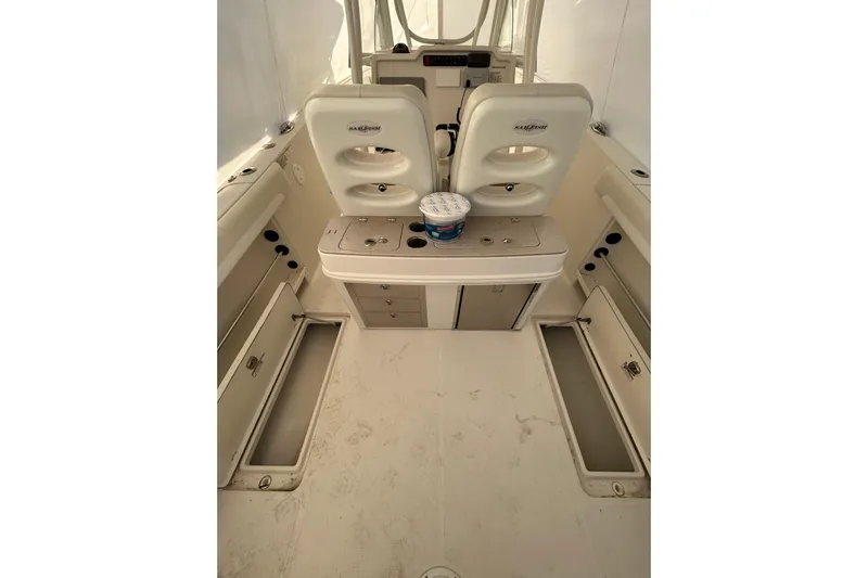 Yacht Photos Pics 2015 Sailfish 290 CC boat interior with storage compartments and seating.