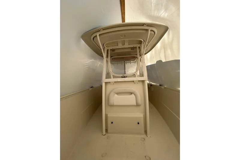  Yacht Photos Pics 2015 Sailfish 290 CC boat interior with center console and protective covering.