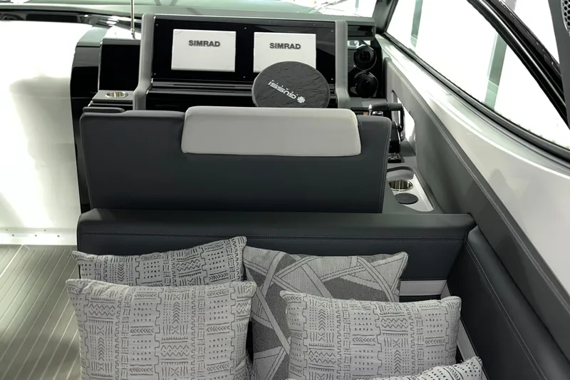  Yacht Photos Pics 2023 Cruisers Yachts 38 GLS interior with Simrad displays and patterned cushions.