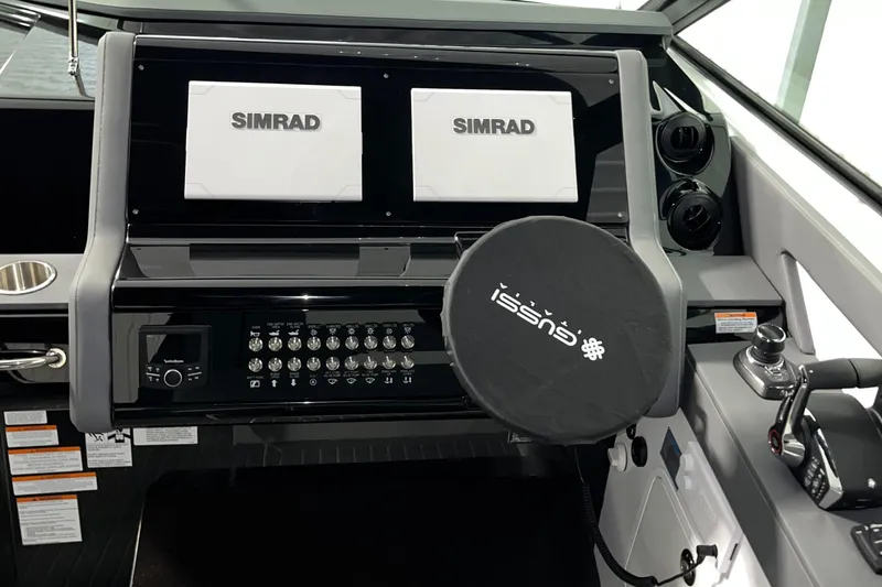  Yacht Photos Pics 2023 Cruisers Yachts 38 GLS helm with dual Simrad displays and control panel.