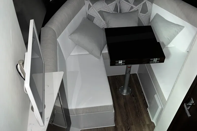  Yacht Photos Pics 2023 Cruisers Yachts 38 GLS interior with modern seating and table setup.