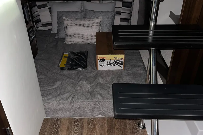  Yacht Photos Pics 2023 Cruisers Yachts 38 GLS interior cabin with bed and steps.