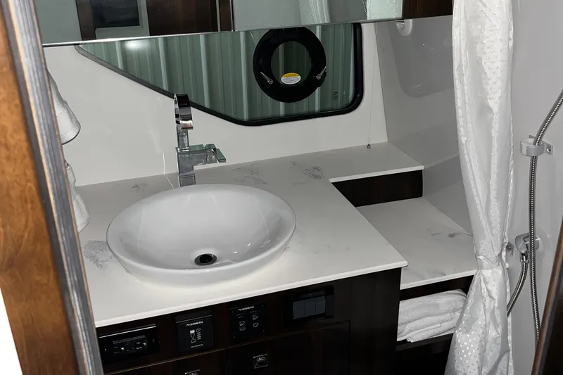  Yacht Photos Pics 2023 Cruisers Yachts 38 GLS bathroom with modern sink and fixtures.