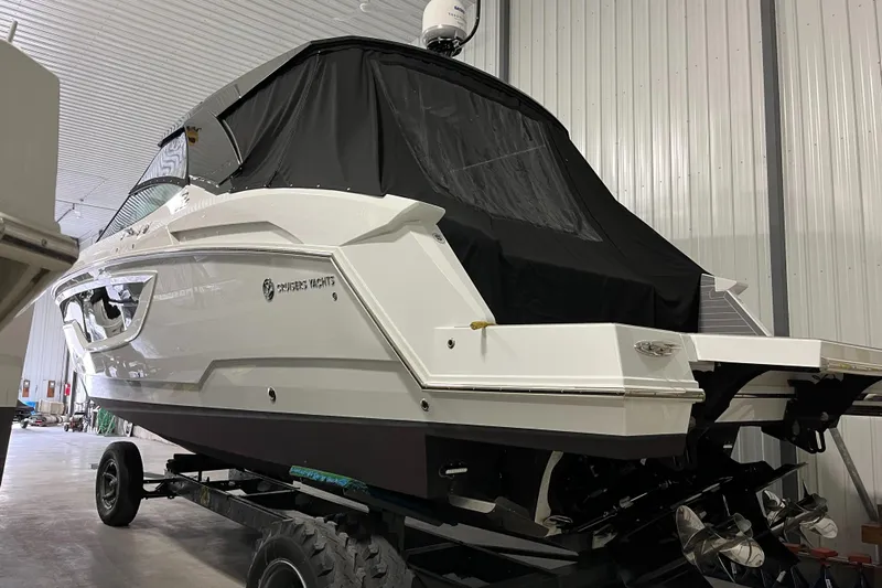  Yacht Photos Pics 2023 Cruisers Yachts 38 GLS in storage, covered and elevated on a trailer.