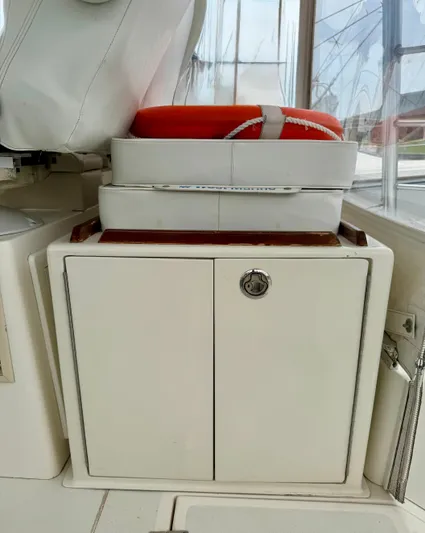 Pandemonium Yacht Photos Pics 2000 Liberty 42 Express boat storage with life preserver and equipment.