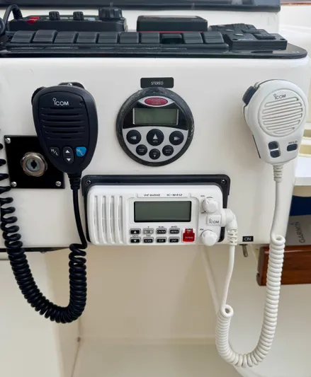 Pandemonium Yacht Photos Pics Boat communication system on a 2000 Liberty 42 Express, featuring Icom radios and control panel.