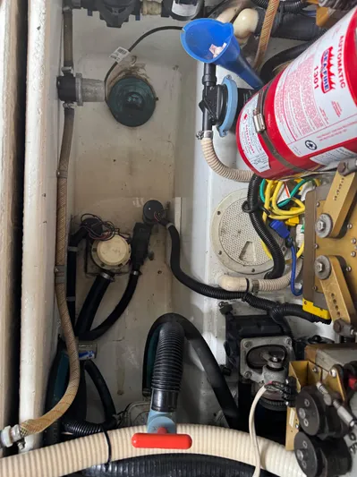 Pandemonium Yacht Photos Pics Engine compartment of a 2000 Liberty 42 Express boat with fire extinguisher and wiring.