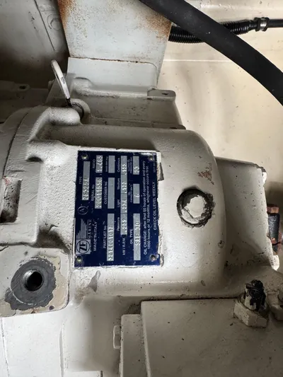 Pandemonium Yacht Photos Pics Close-up of a mechanical component with a blue identification plate on a 2000 Liberty 42 Express.