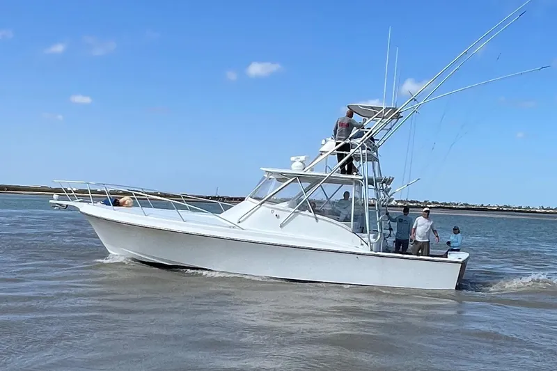 Pandemonium Yacht Photos Pics 2000 Liberty 42 Express boat cruising on a sunny day.