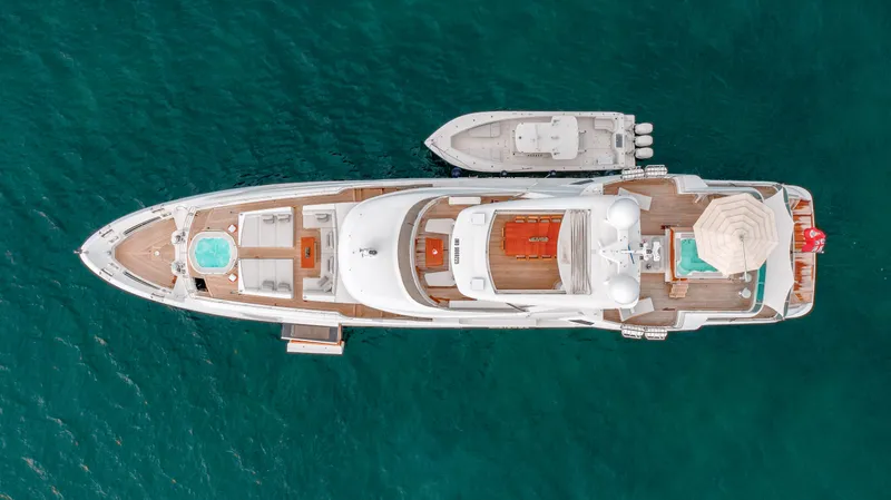 Patience Yacht Photos Pics Aerial view of 2012 Benetti Classic Supreme 132 yacht on turquoise water.