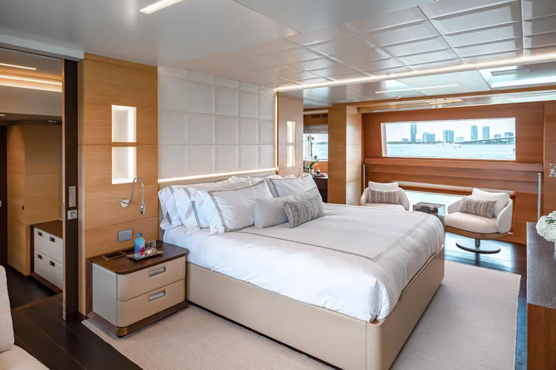 Patience Yacht Photos Pics Luxurious bedroom on 2012 Benetti Classic Supreme 132 yacht with modern decor and ocean view.