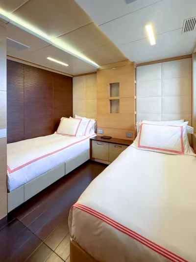 Patience Yacht Photos Pics Luxurious twin bedroom on 2012 Benetti Classic Supreme 132 yacht, featuring modern design and cozy ambiance.
