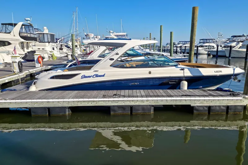  Yacht Photos Pics 2015 Sea Ray 350 SLX boat docked at marina, surrounded by other vessels.
