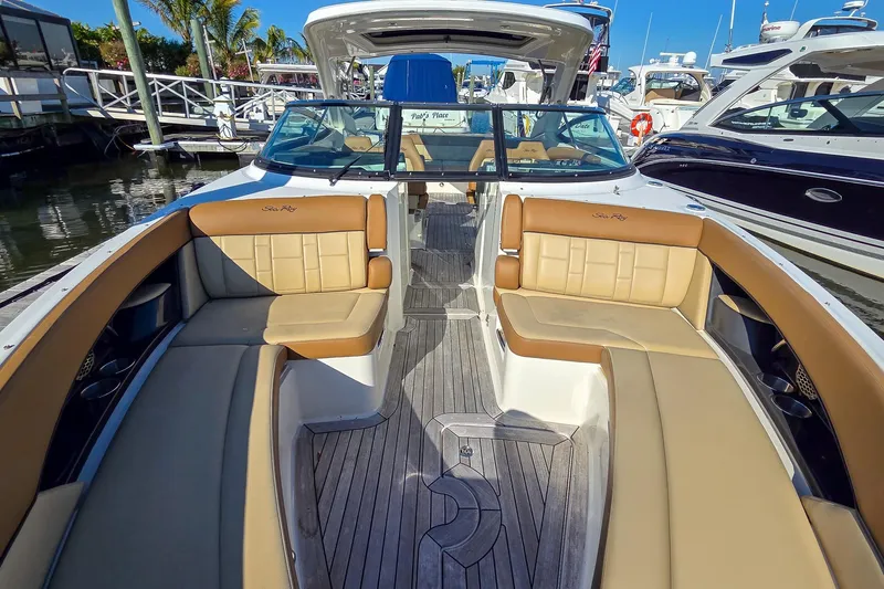  Yacht Photos Pics 2015 Sea Ray 350 SLX boat with luxurious seating and sleek design at a marina.