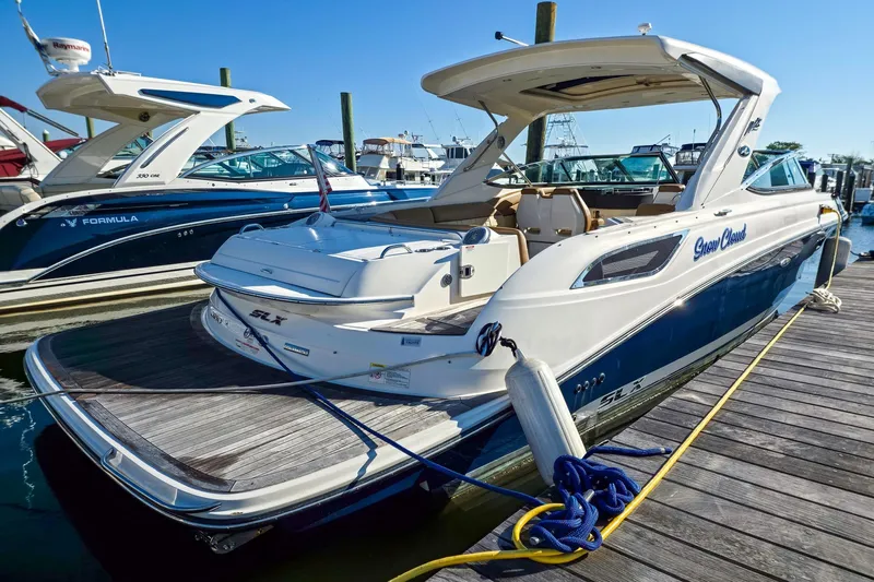  Yacht Photos Pics 2015 Sea Ray 350 SLX boat docked at marina, featuring sleek design and spacious deck.