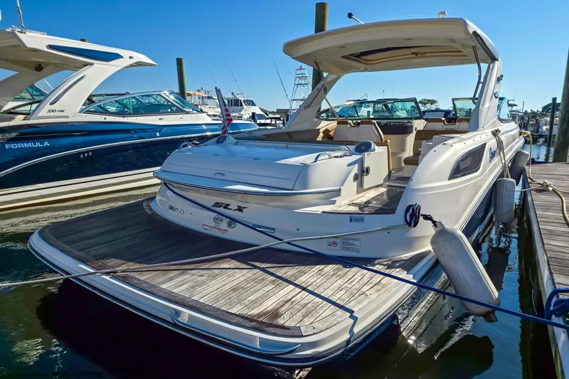  Yacht Photos Pics 2015 Sea Ray 350 SLX luxury boat docked at marina, showcasing sleek design.
