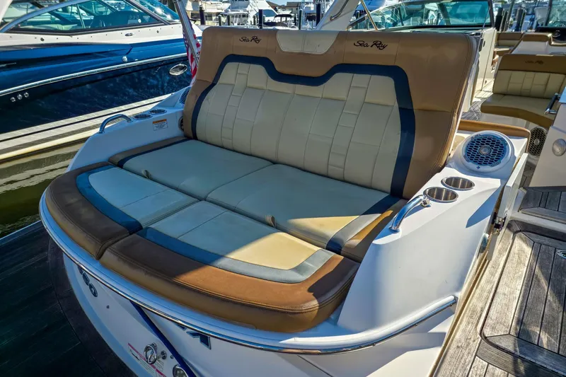  Yacht Photos Pics Luxury seating on a 2015 Sea Ray 350 SLX boat, featuring cup holders and speakers.