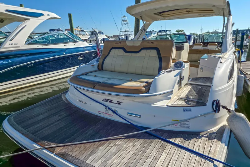  Yacht Photos Pics 2015 Sea Ray 350 SLX luxury boat docked at marina, showcasing spacious seating.