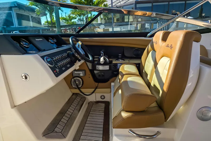  Yacht Photos Pics 2015 Sea Ray 350 SLX boat interior with tan leather seats and control panel.