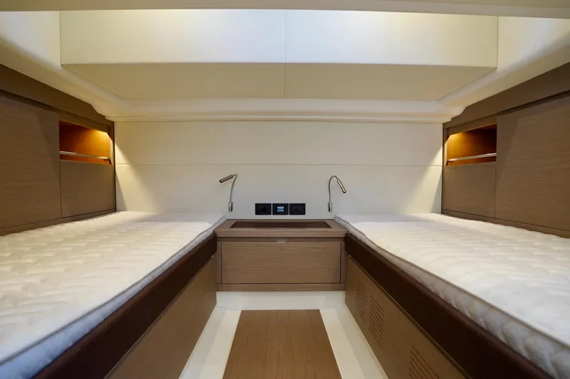  Yacht Photos Pics Luxurious cabin interior of 2023 Pardo Yachts, featuring twin beds and modern lighting.