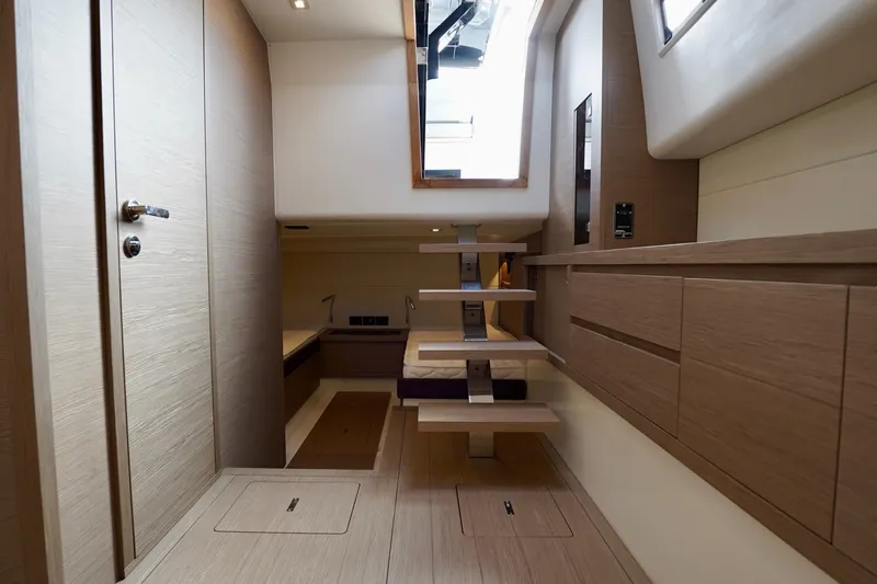  Yacht Photos Pics Luxurious interior of 2023 Pardo Yachts, featuring modern wooden cabinetry and sleek design.