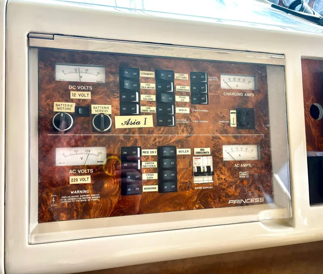  Yacht Photos Pics Electrical control panel of a 1994 Princess 45 Flybridge yacht, featuring voltage and amp meters.