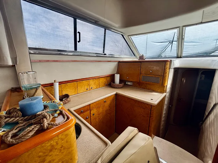  Yacht Photos Pics Interior of 1994 Princess 45 Flybridge yacht with wooden cabinetry and nautical decor.