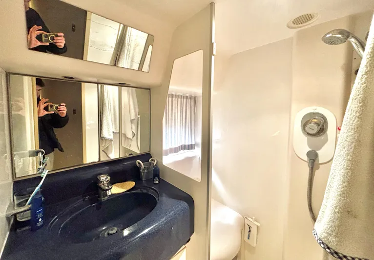  Yacht Photos Pics Bathroom interior of 1994 Princess 45 Flybridge yacht with sink and shower.