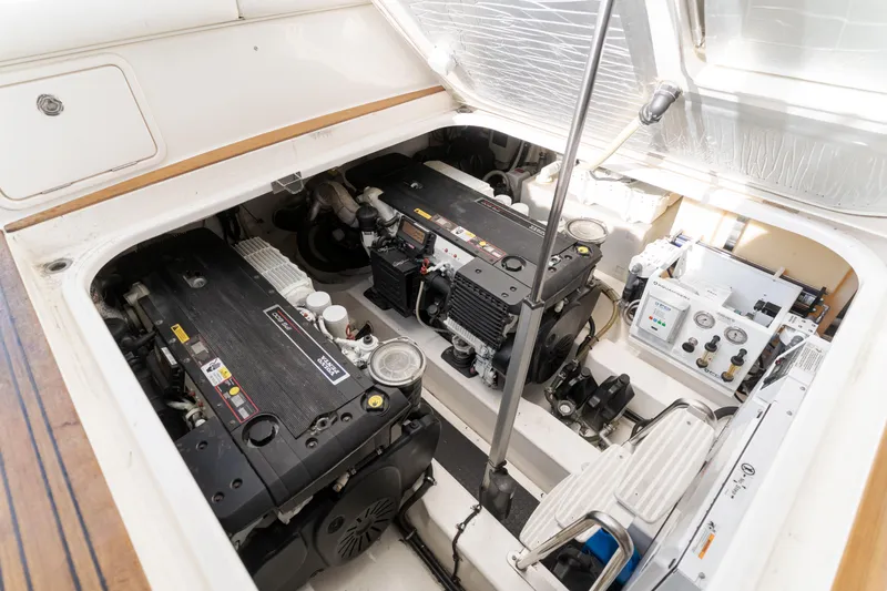 No Contingencies Yacht Photos Pics Engine room of a 2012 Riviera 44 Sport Yacht, showcasing dual engines and control systems.