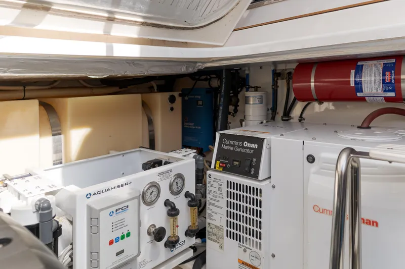 No Contingencies Yacht Photos Pics Engine room of 2012 Riviera 44 Sport Yacht with Cummins Onan marine generator.
