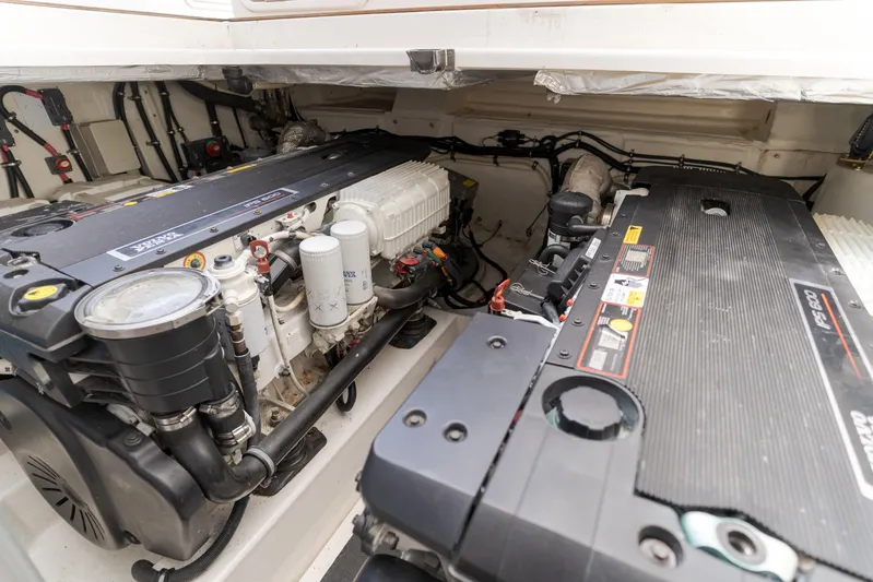 No Contingencies Yacht Photos Pics Engine room of a 2012 Riviera 44 Sport Yacht, showcasing dual engines and components.