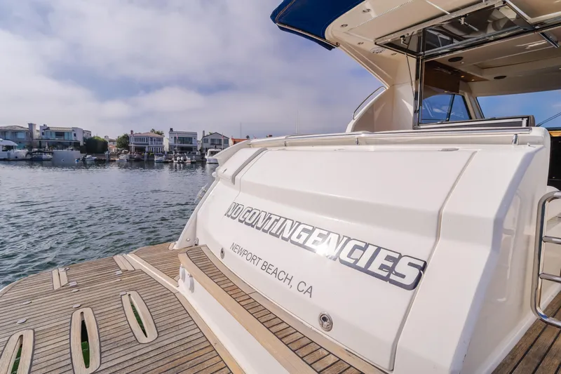No Contingencies Yacht Photos Pics 2012 Riviera 44 Sport Yacht docked in Newport Beach, CA, with "No Contingencies" nameplate.