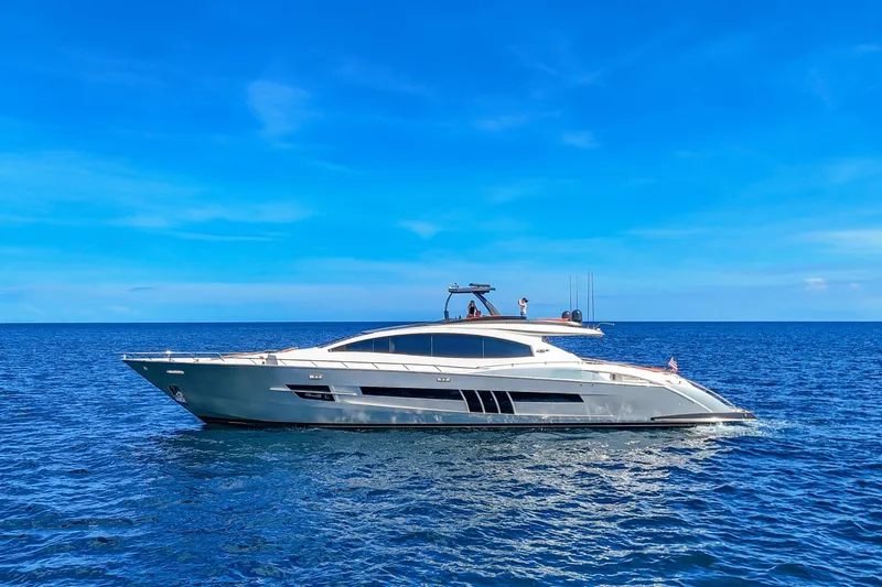  Yacht Photos Pics Luxury 2010 Lazzara LSX 92 yacht cruising on open blue sea under clear sky.